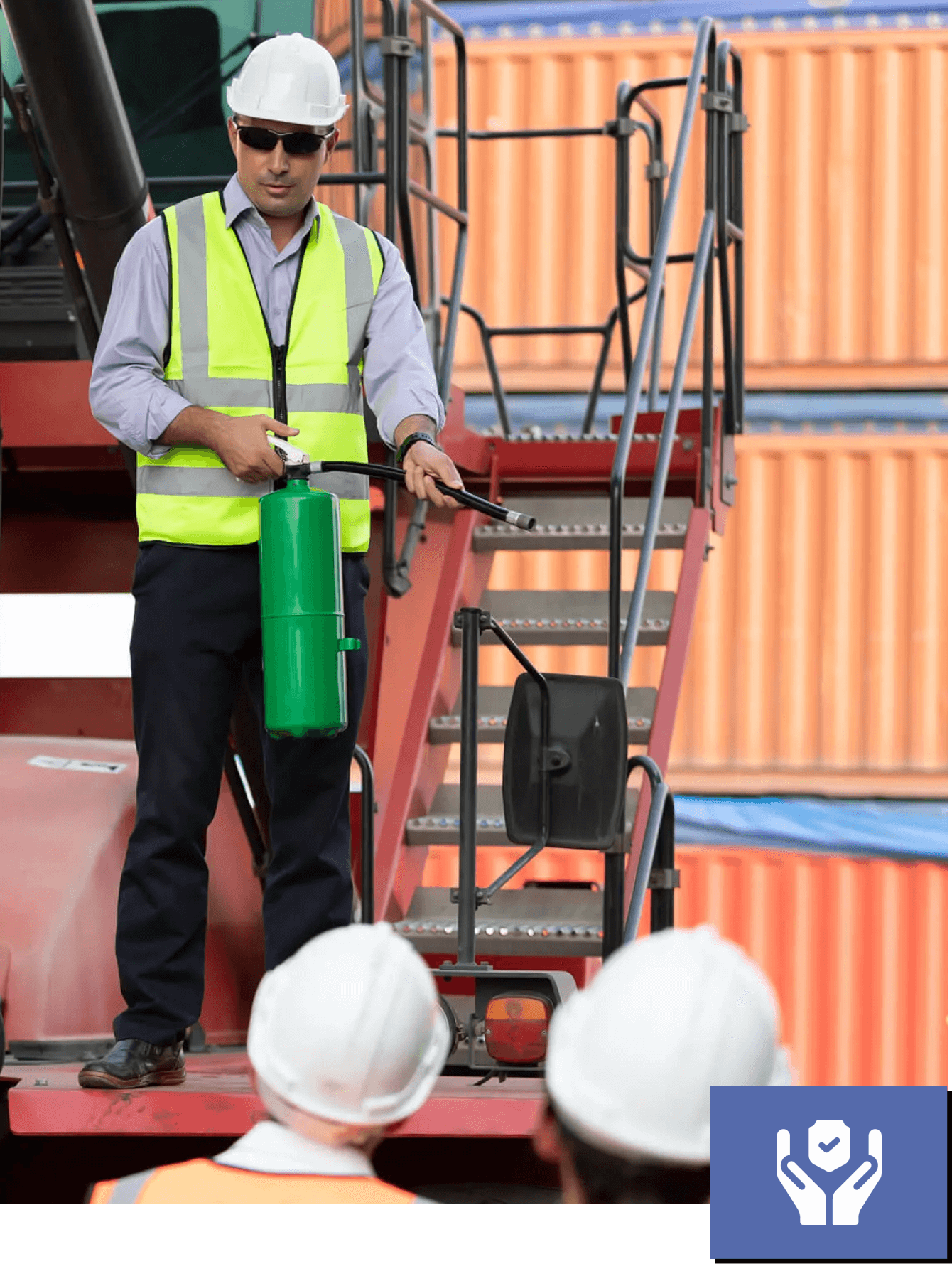 Worker demonstrating safety equipment on site.